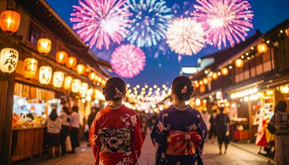 打ち上げ花火と浴衣姿の女性 打ち上げ花火と浴衣姿の女性の写真