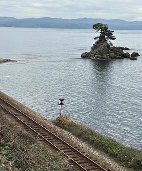 Railway and Yoshitsune Rock at Amaharashi Coast, JPG