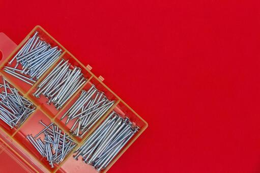 赤背景の釘とケース 釘,工具,道具の写真素材
