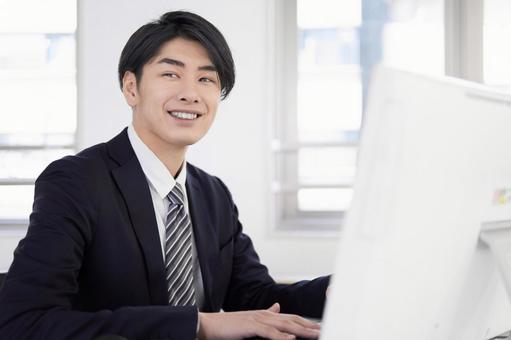 Japanese male businessman working on a computer with a smile, business, office, businessman, JPG