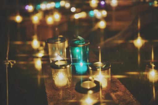 ガラス容器に入ったカラフルな灯り キャンドル,灯り,光の写真素材