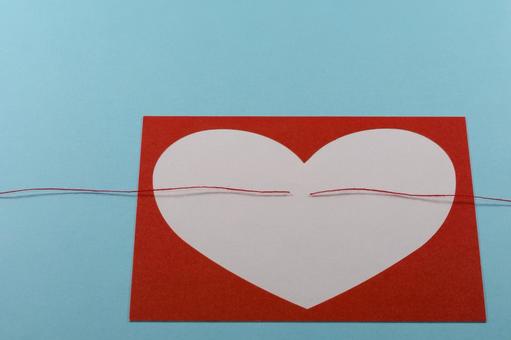 ハートと切れた赤い糸で縁が切れるイメージ 離婚,別れる,喧嘩の写真素材
