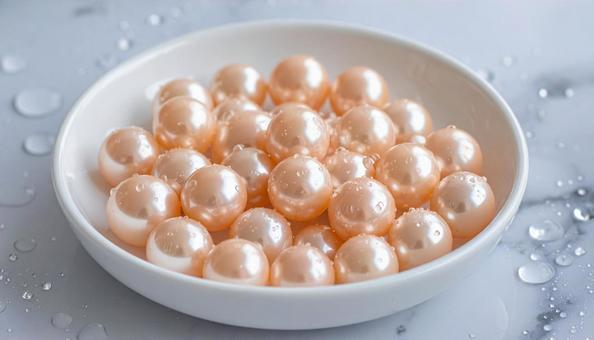 きらきら輝く光沢のあるピンクの真珠の写真