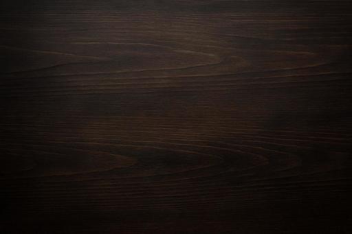 【背景素材】黒色の木目の写真