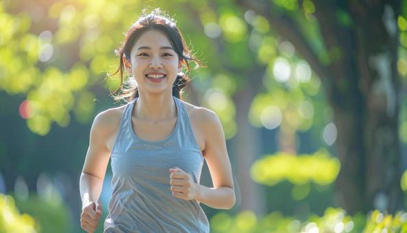 ジョギングする女性 ジョギングする女性の写真