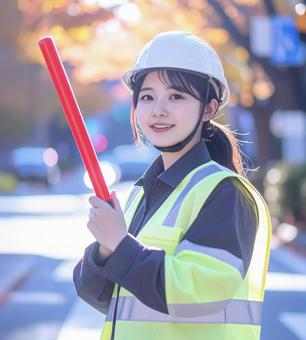 女性の交通誘導員 女性の交通誘導員の写真