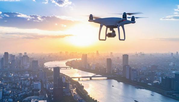 都市上空を飛行するドローン 都市上空を飛行するドローンの写真