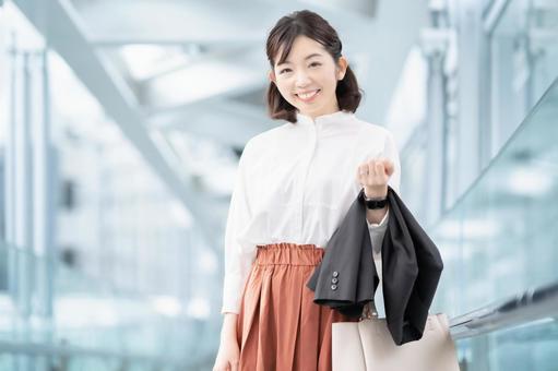 Working mother with a smile, female, business person, office, JPG