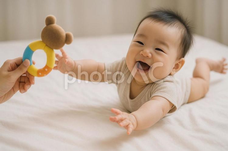 オモチャを取ろうとする赤ちゃん ai生成,人物,赤ちゃんの写真素材
