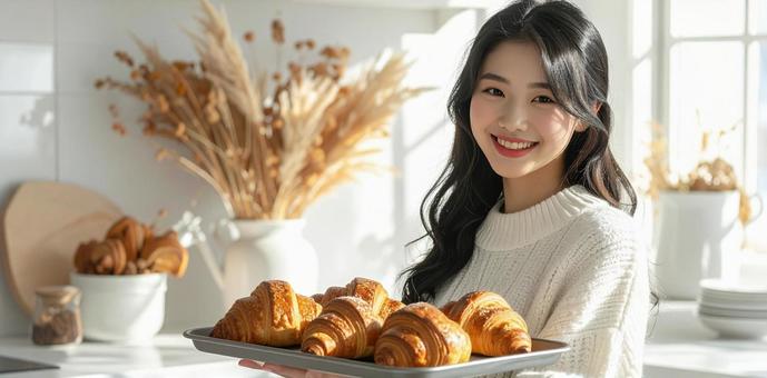 クロワッサンと女性 クロワッサンと女性の写真