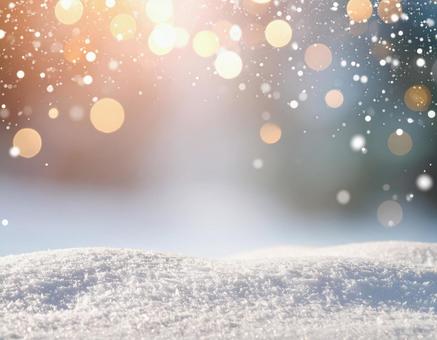 雪と光のボケが輝く冬の幻想的背景 雪と光のボケが輝く冬の幻想的背景の写真
