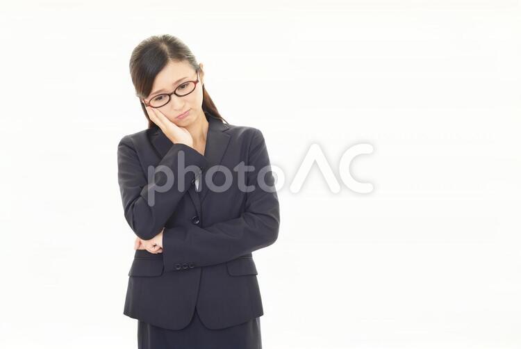 憂鬱な表情のビジネスウーマン 女性,ビジネウーマン,女の写真素材