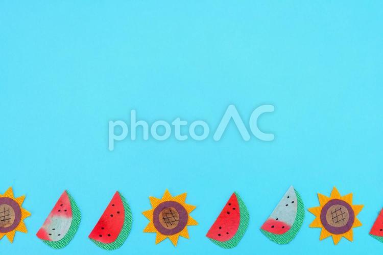 スイカとひまわりの背景素材 スイカ,向日葵,ひまわりの写真素材