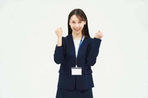 A woman in a suit cheering with a guts pose, व्यापार, एक बिज़नेसवुममन, समर्थन, JPG