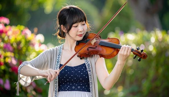 バイオリンを弾く日本人女性 バイオリンを弾く日本人女性の写真