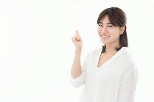若い女性 ガッツポーズ 若い女性 ガッツポーズの写真