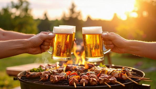 ビールで乾杯するバーベキュー ビールで乾杯するバーベキューの写真