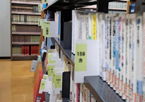 Books on shelves in a library, JPG