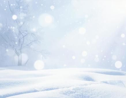雪と光のボケが輝く冬の幻想的背景 雪と光のボケが輝く冬の幻想的背景の写真