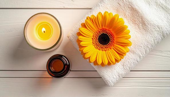 アロマオイルの瓶　ガーベラの花の写真