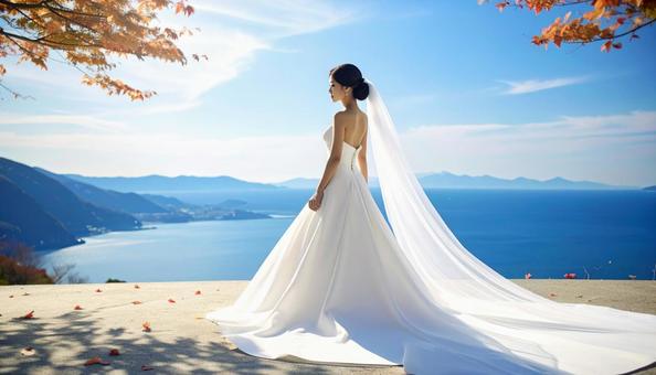 秋の紅葉の中のウェデイングドレス姿の花嫁 秋の紅葉の中のウェデイングドレス姿の花嫁の写真