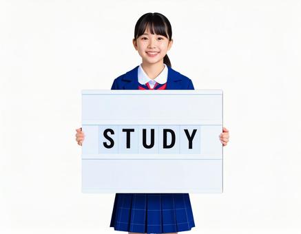 STUDYと書かれたボードをもつ女子生徒 STUDYと書かれたボードをもつ女子生徒の写真