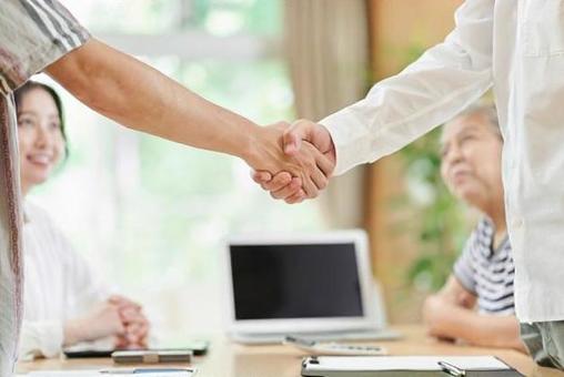 Young men and older men shaking hands, handshake, agreement, success, JPG