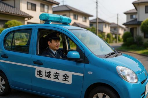 青パトで巡回する地域警察官 青パトで巡回する地域警察官の写真