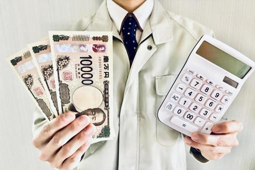 作業員スタッフとお金のイメージ 作業服,コスト,男性の写真素材