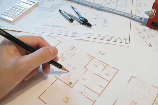 新築注文住宅の間取図を作成中の仕事風景 新築注文住宅の間取図を作成中の仕事風景 設計図,間取り図,計画の写真素材