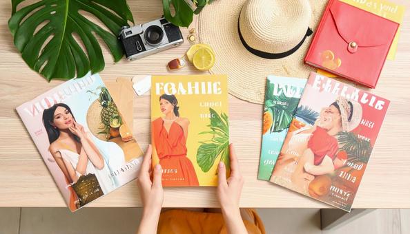 テーブルに置かれた海外ファッション雑誌 テーブルに置かれた海外ファッション雑誌の写真