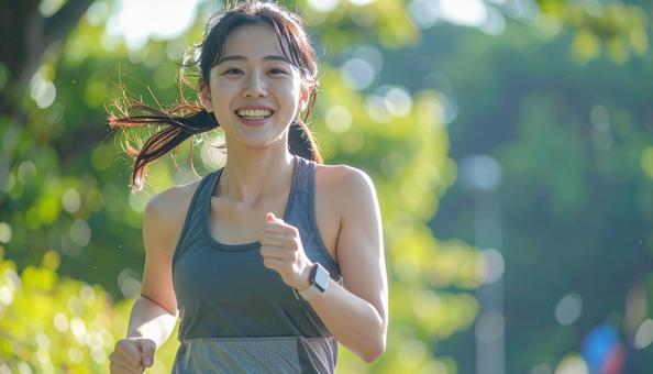 ジョギングする女性 ジョギングする女性の写真