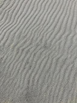 海辺の風でできた砂浜の波 海辺の風でできた砂浜の波の写真