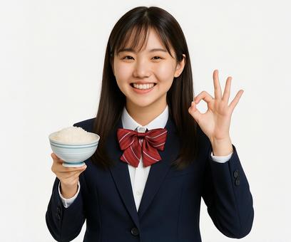 白米の入った茶碗とオッケーポーズの女性 白米の入った茶碗とオッケーポーズの女性の写真