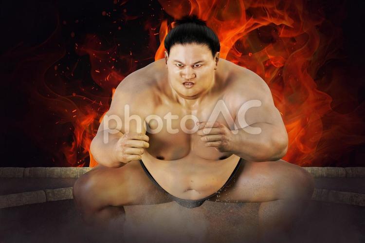 勝負を賭けた力士の闘志の炎が燃え上がる ちょんまげ,髷,土俵の写真素材