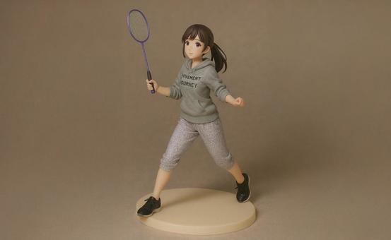 バドミントンをする女性のフィギュア バドミントンをする女性のフィギュアの写真