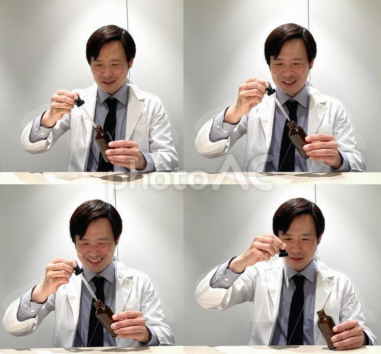 笑顔で薬の配合をする男性、薬剤師 白衣,研究,薬品の写真素材