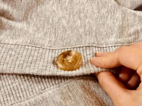 ボタンを閉める ボタンを閉める ボタン,洋服,洋服のボタンの写真素材