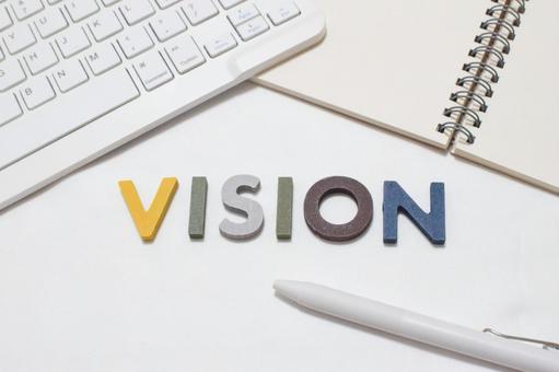 The word "Vision" is on the desk., JPG
