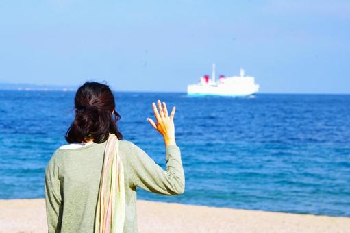 船を見送る 海,人,ビーチの写真素材