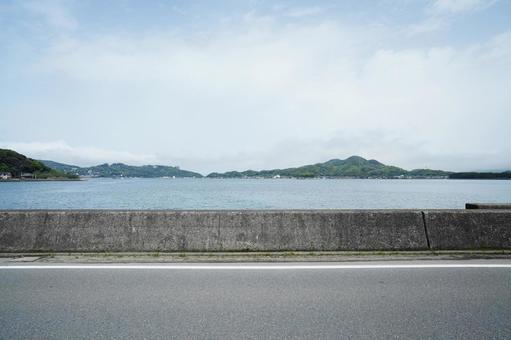 福岡 糸島 防波堤沿いの道2 防波堤,海の見える道,道路の写真素材
