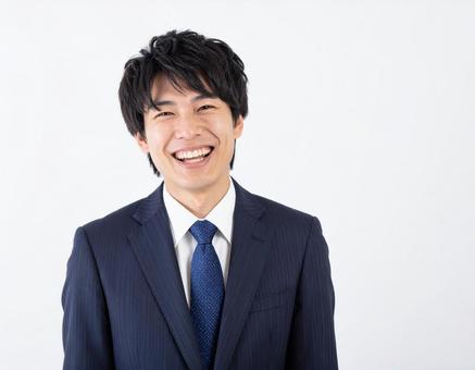 笑うビジネスマン 笑うビジネスマンの写真