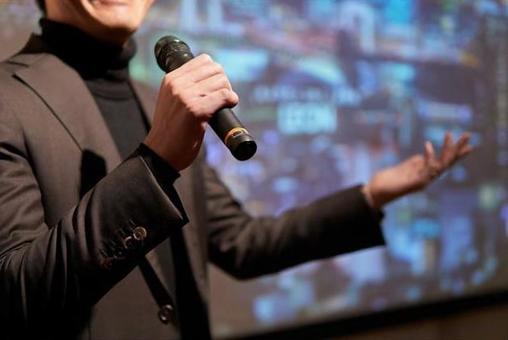 A businessman who takes the stage and gives a performance, businessman, presentation, the platform, JPG