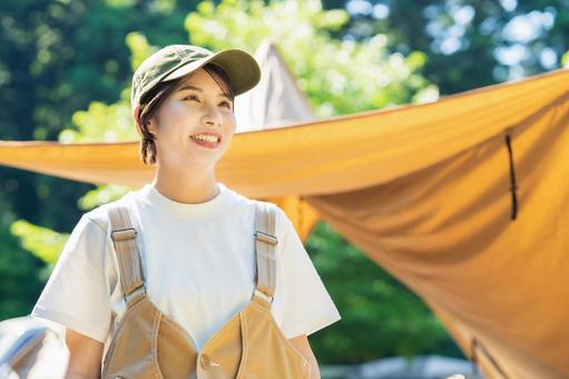 Solo camp image-A young woman relaxing in a tent, शिविर, सोलो शिविर, महिला, JPG