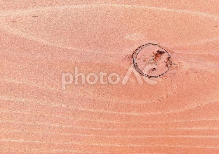 薄ピンク色の木肌　流線のような木目の背景 木目,板,年輪の写真素材
