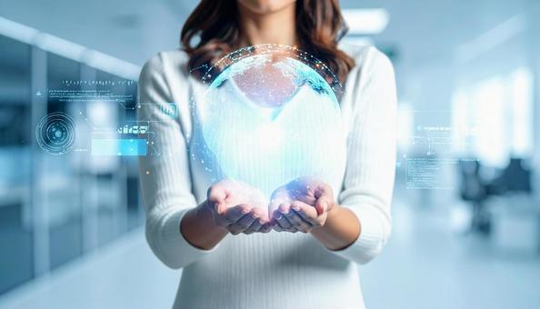 ホログラムのデジタル地球儀を持つ女性 ホログラムのデジタル地球儀を持つ女性の写真