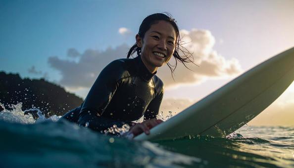 サーフィンをする女性 サーフィンをする女性の写真