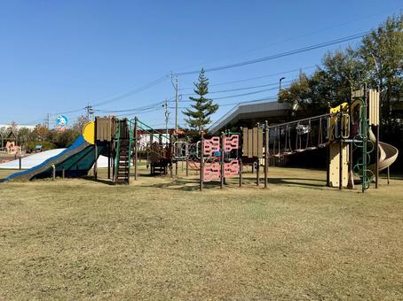 秋の昼間　福井少年運動公園　遊具 山,パーゴラ,ベンチの写真素材