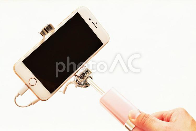 自撮り棒 自撮り棒,セルカ棒,スマホの写真素材