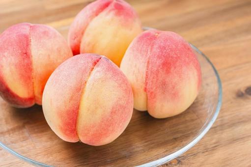 Peaches served on a glass plate (wood grain background), JPG Peaches served on a glass plate (wood grain background), JPG